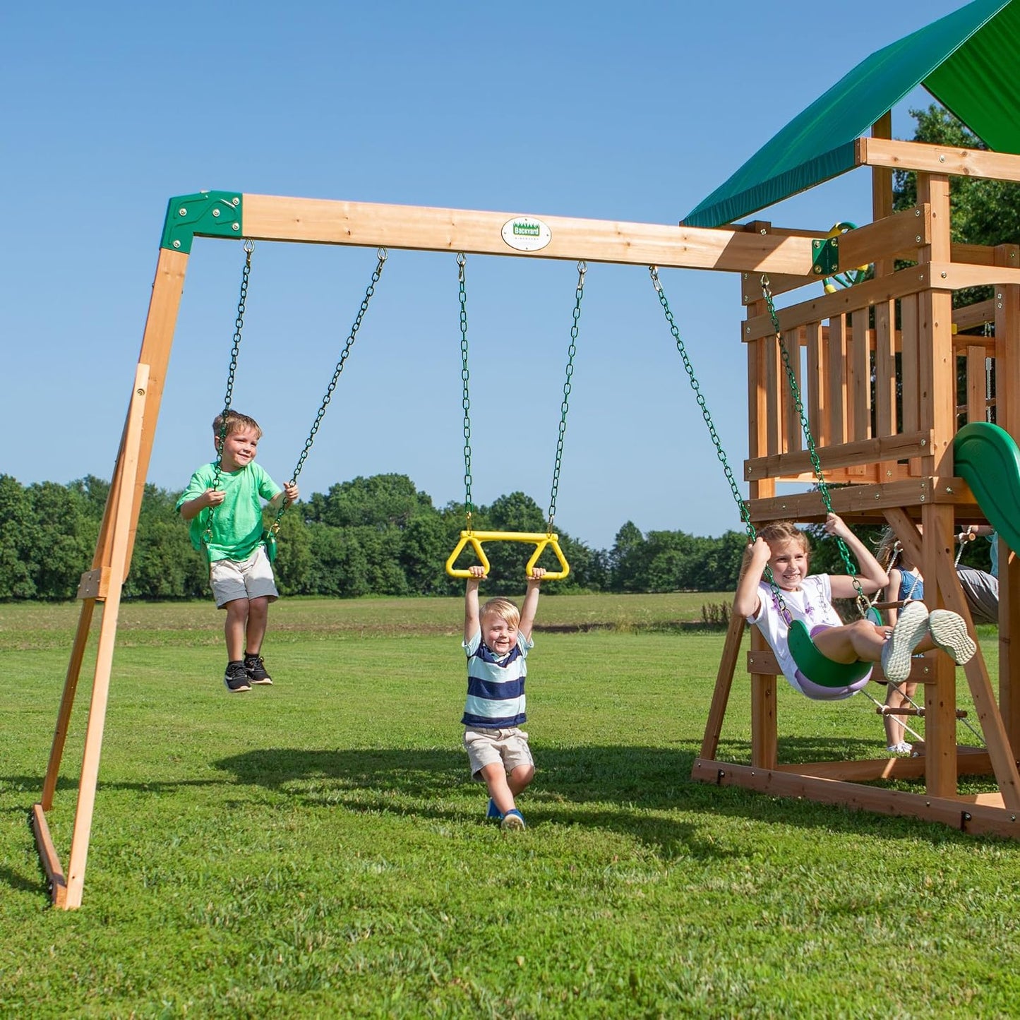 Backyard Discovery Mount Mckinley Cedar Wood Swing Set with Wave Slide, Play Deck, Double Rock Wall, Rope Ladder, Web Swing, Belt Swings, Toy Telescope, Steering Wheel, Sandbox Area, Outdoor Playset
